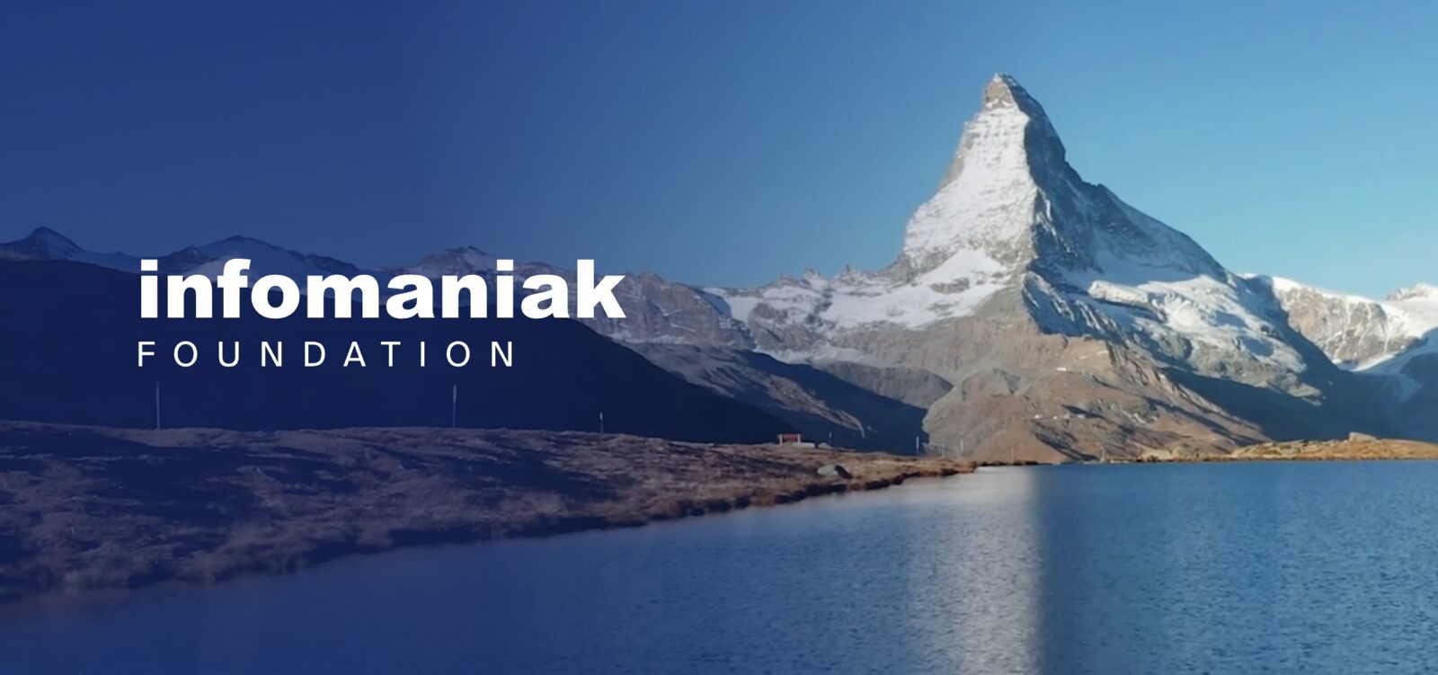 The Infomaniak Foundation campaign image: the Matterhorn above a still alpine lake, with the 'infomaniak FOUNDATION' wordmark.